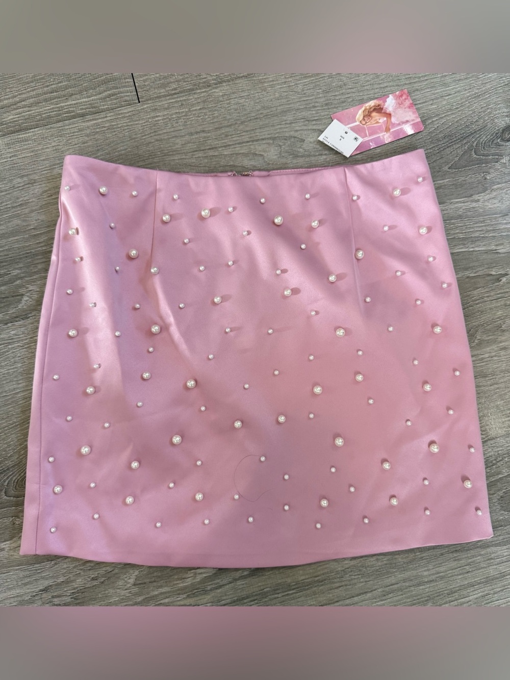Megan Moroney x Cloud 9 pink mini skirt w/ beaded pearls